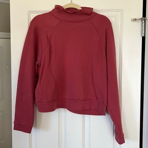 Pink cropped turtleneck sweatshirt